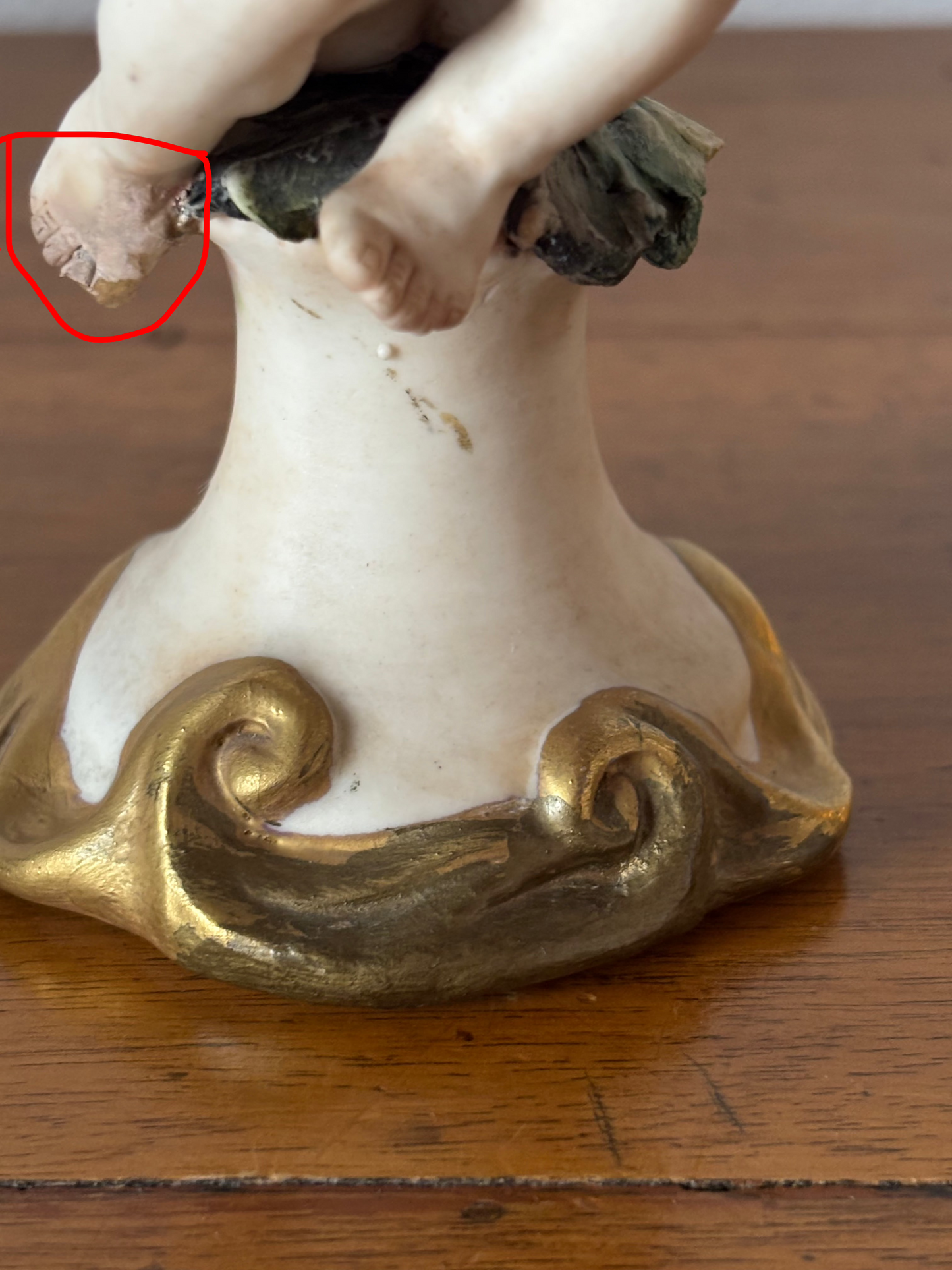 Cherub figurine with blanket