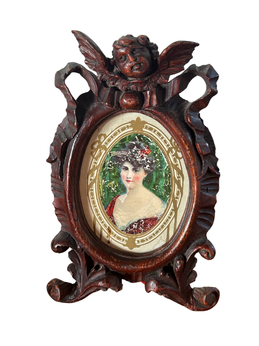 Cornice vintage in legno intagliato con angelo