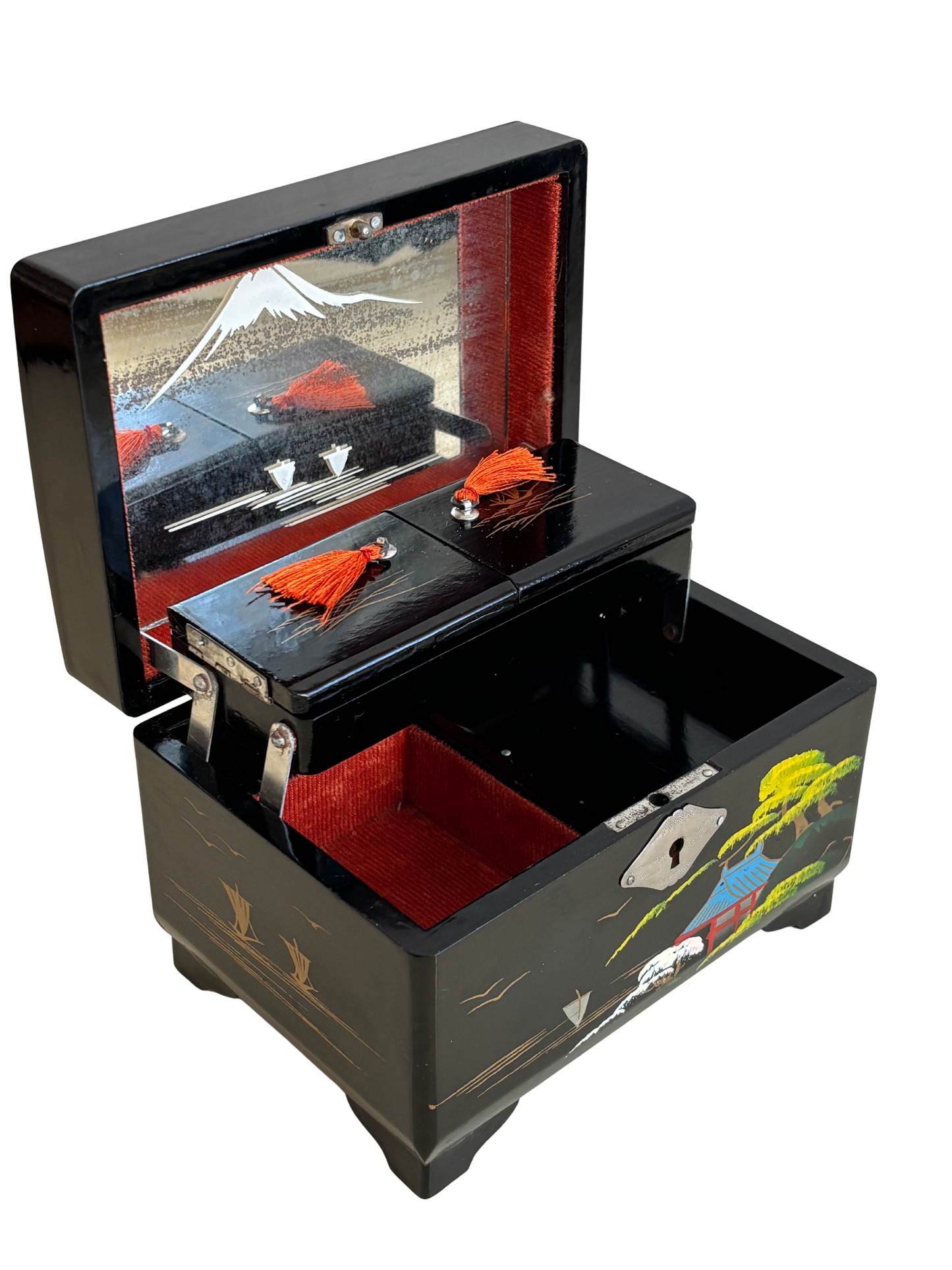Small vintage music box with key, lacquered case and Mount Fuji on the mirror