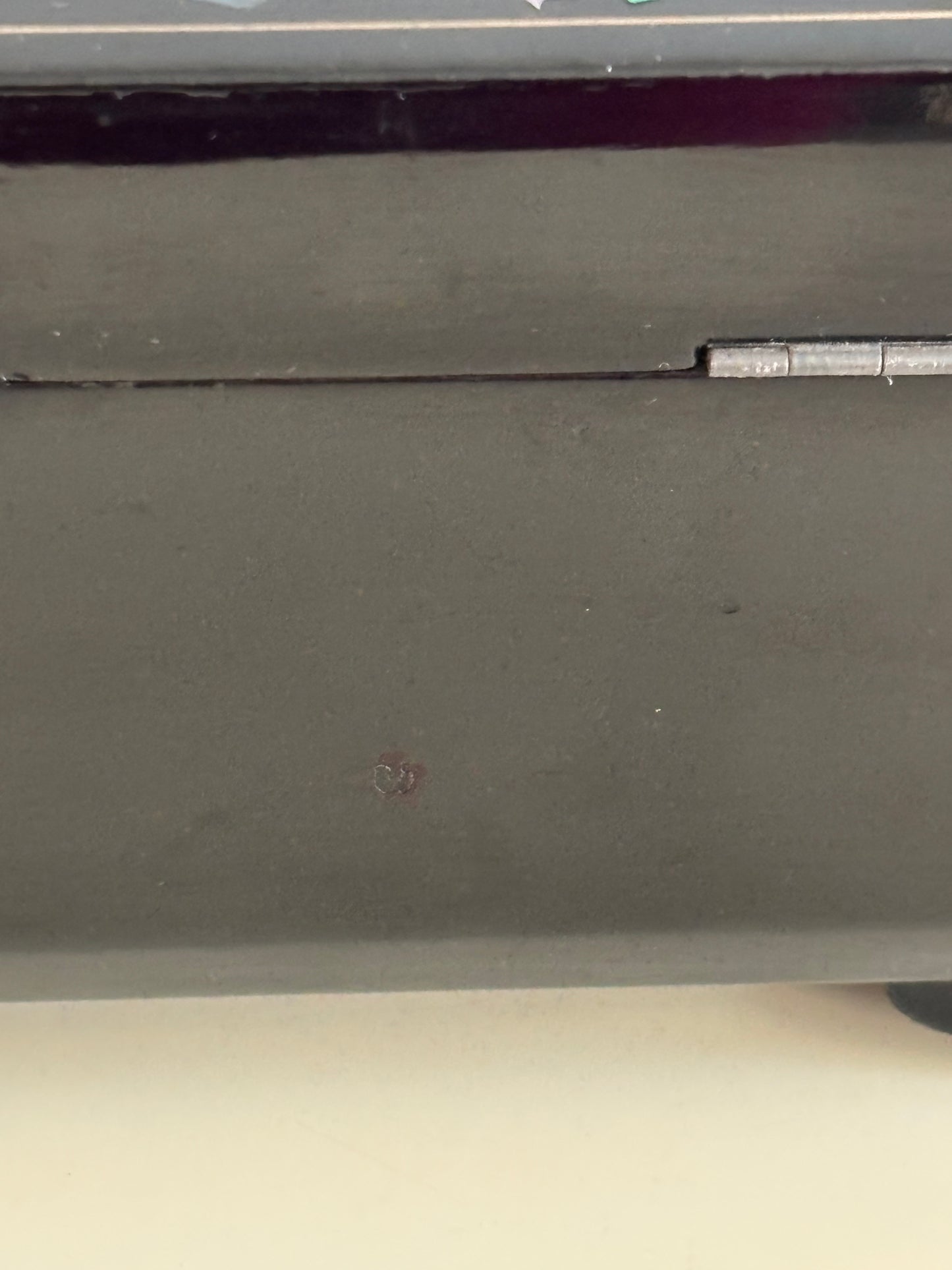 Small vintage music box with key, lacquered case and Mount Fuji on the mirror