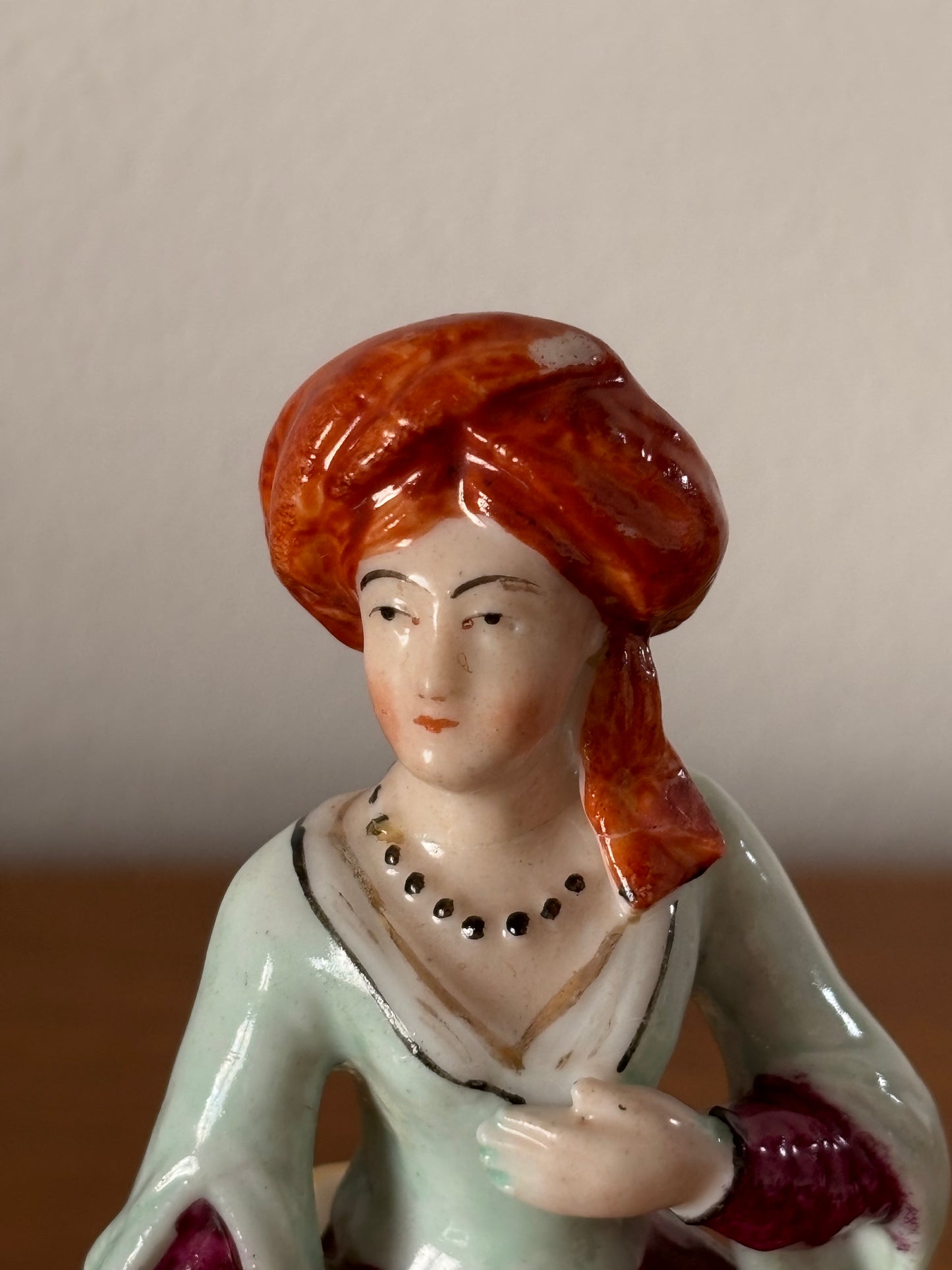 Antique inkstand with a figurine of a woman in 18th-century attire