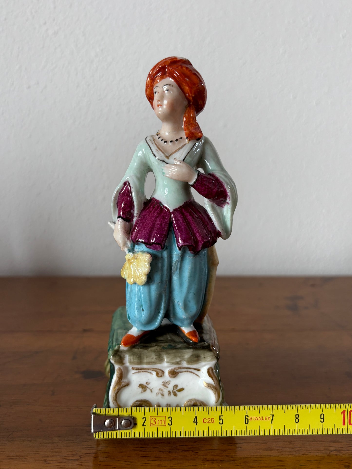 Antique inkstand with a figurine of a woman in 18th-century attire