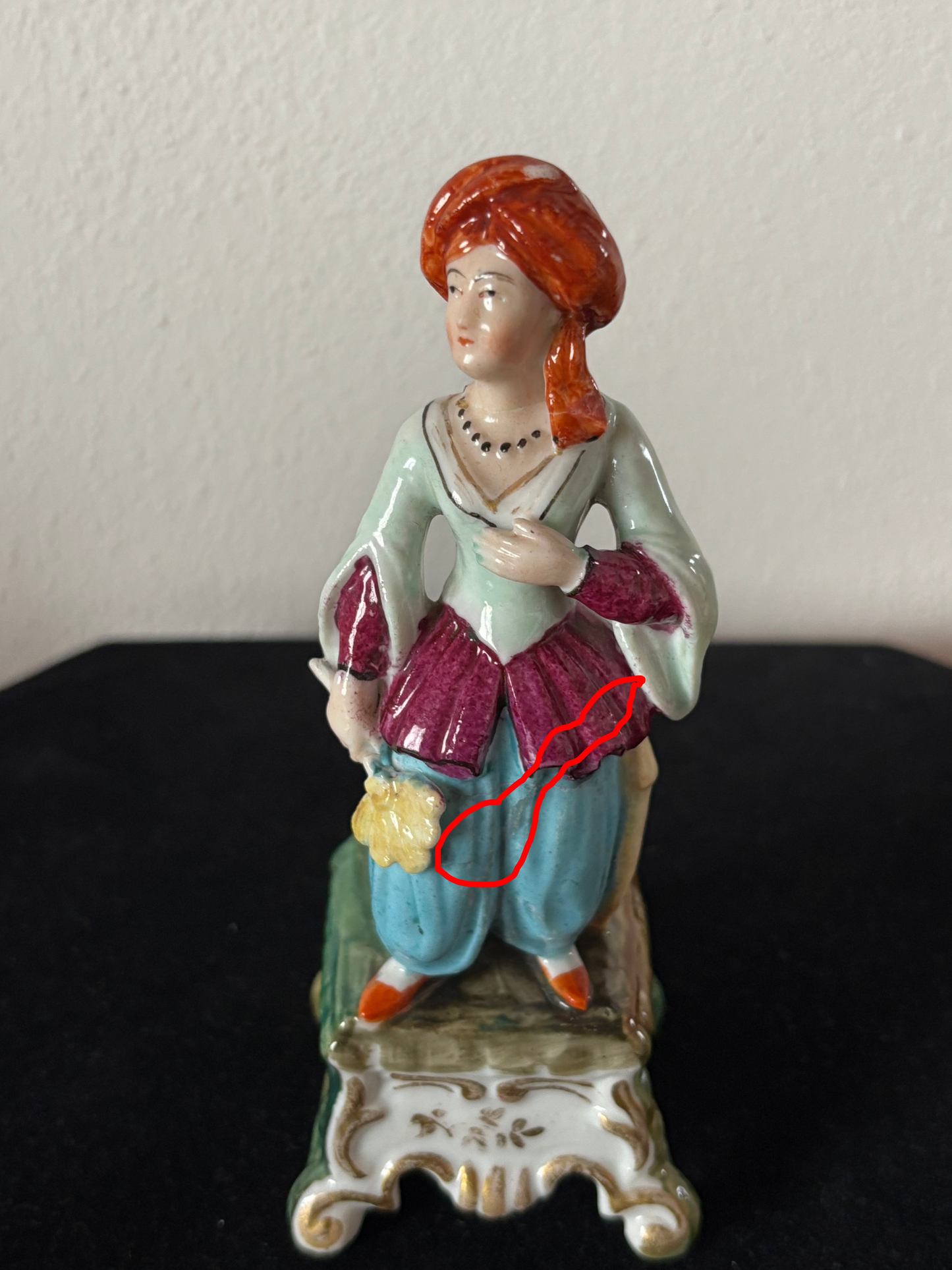 Antique inkstand with a figurine of a woman in 18th-century attire